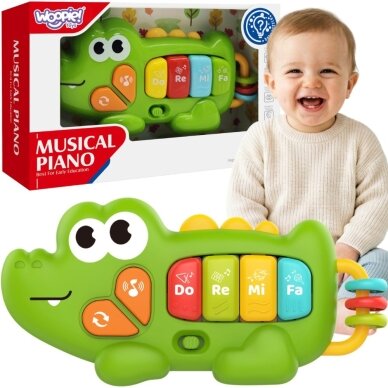WOOPIE BABY Interaktyvus pianinas krokodilas vargonėliai muzikiniai garsai šviesa 18m+ WOOPIE BABY Interaktyvus pianinas krokodilas vargonėliai muzikiniai garsai šviesa 18m+